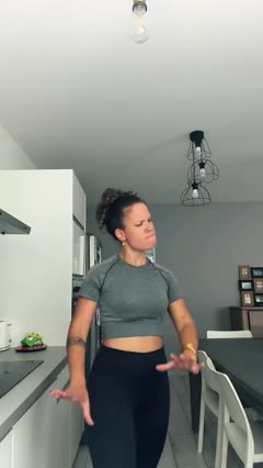 A good photo for Bad Times AI: one woman standing in a room, head to thighs in frame, arms free